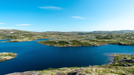 Obraz premium landscape Russian North view in the tundra with a mountain river and a lake in the mountains
