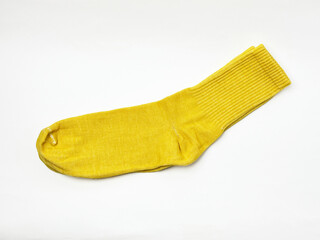 Yellow sock on a white background