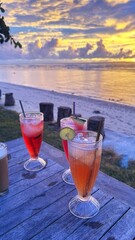 Refreshing Drinks on the Beach at Sunset