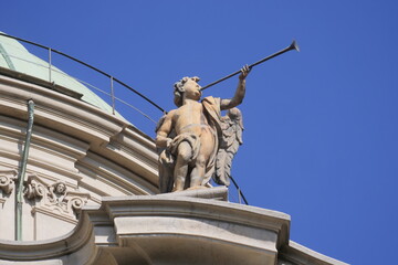 Obraz premium Sculpture with trumpet on sant' Alessandro Zebedia basilic in Milan, Lombardy, Italy