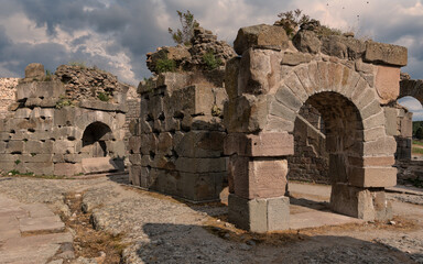 Majestic ancient stone ruins of the Acropolis of Pergamon, featuring impressive arches and walls...
