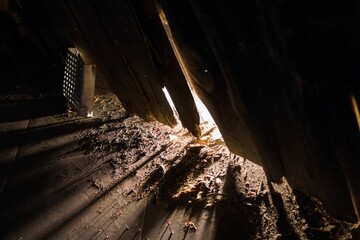 Dusty Attic Interior with Sunbeams. A Glimpse into Old Architecture and Neglected Spaces.