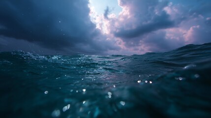 Dark clouds gather over the ocean as waves ripple beneath a dramatic sky, creating an atmospheric landscape at twilight
