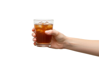 Hand holding a glass of iced tea with ice cubes against a transparent background, isolated on white background