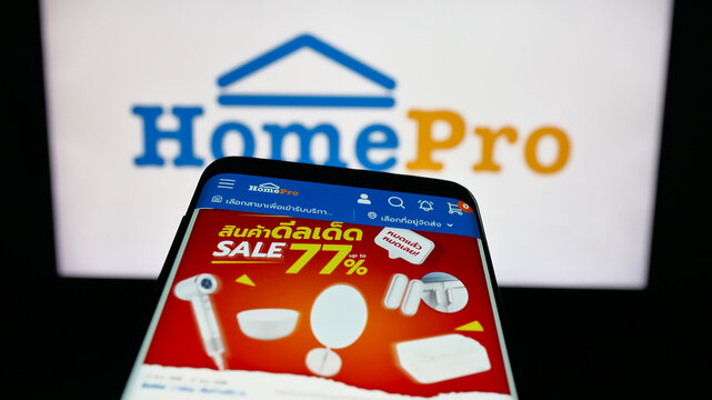 Stuttgart, Germany - 08-25-2025: Mobile phone with website of Thain home improvement retail company HomePro on screen in front of logo. Focus on top-left of phone display.