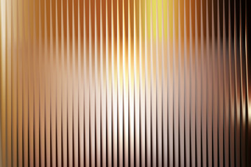 Abstract vertical stripes with gradient of warm colors blending into a soft bokeh effect background