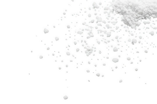 Scattered sea salt grains isolated on transparent background, top view, studio shot