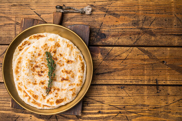 Potato Stuffed Flat Bread Aloo paratha, Traditional Indian food. wooden background. top view