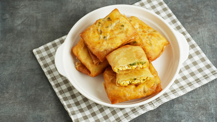 Martabak Tahu or Tofu Spring Rolls, filled with tofu, leek and egg. Indonesian food
