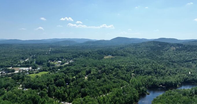 Drone view of the White Mountains and Saco River in New England on a sunny day