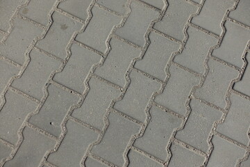 Background - gray concrete dumble interlocking pavement