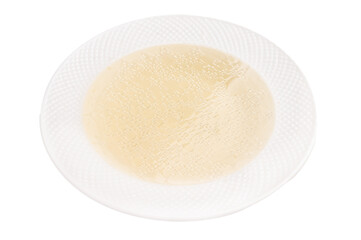 Bowl of chicken broth isolated on white background. top view
