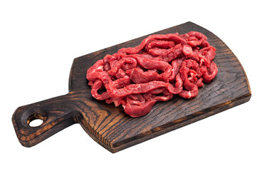 Uncooked Raw beef sliced meat, strips for cooking beef stroganoff on wooden board isolated on white...