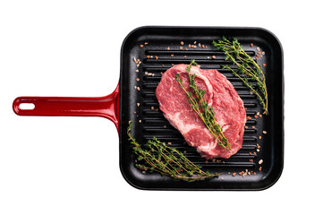 Raw Rib eye steak in a skillet, marbled prime beef meat isolated on white background