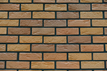 brick veneer wall with stretcher bond pattern in shades of brown texture