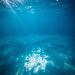 Underwater view of sunbeams filtering through clear blue ocean water