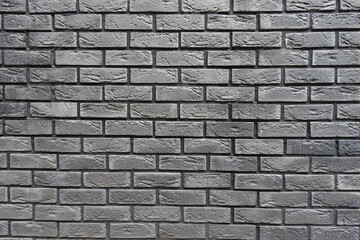 Obraz premium Backdrop - brick veneer wall with stretcher bond pattern in shades of gray