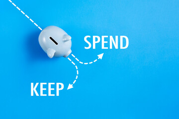 Piggy bank with spend or keep text	