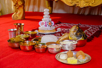Traditional Cultural Offering with Food and Topor on Decorative Surface