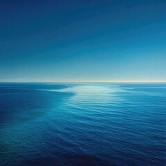 Obraz premium Wide shot of calm ocean, clear blue sky