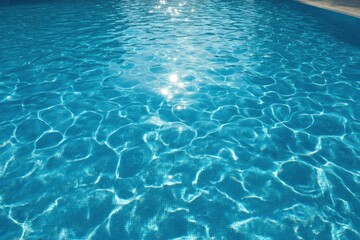 Gleaming, blue pool water with sun reflections creates a soothing, shimmering surface, textured by gentle ripples and light patterns