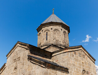Fototapeta premium Scenic view of the Gergeti Trinity Church in the Caucasus Mountains, northern Georgia