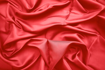 Obraz premium Red silk fabric drapes, studio shot, elegant waves, background blur, textile design