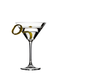 Isolated clear cocktail glass with a lemon twist drink preparation on a light studio setting