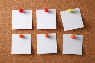 white blank post-it notes on a brown pin board. mockup template for design, ideal for reminders, office, planning, or communication concepts.