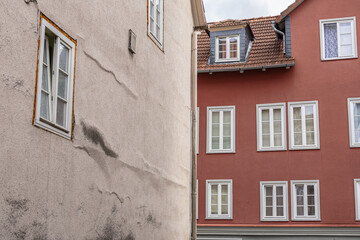 Old residential houses with multiple white windows in Europe