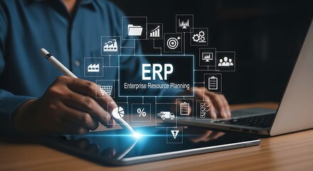 Business professional uses tablet to manage ERP system and data.