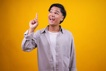Portrait of Excited Asian Man Having Great Ideas, Finding Inspiration or Solution to Problem