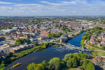 Fototapeta premium Castleford West Yorkshire, united kingdom. Aerial view of the town centre with the river, flour mill and bridges. Historic Roman and Viking town in the north of England