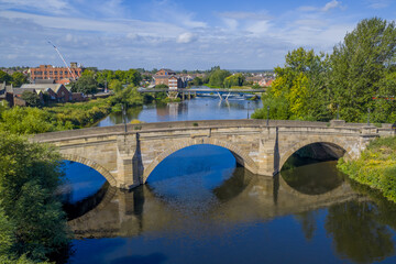 Fototapeta premium Castleford West Yorkshire, united kingdom. Aerial view of the town centre with the river, flour mill and bridges. Historic Roman and Viking town in the north of England