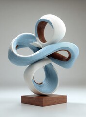 Abstract sculpture, light blue and white, flowing forms, wooden base
