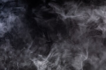 UWispy Gray Smoke Texture on Black Background, Abstract Fog and Vapor Clouds in Darkness, Soft Swirling Mist Effect, Atmospheric Backdrop