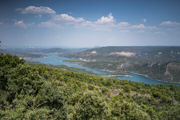 Fototapeta premium Blue Waters of Entrepeñas Reservoir with Forested Hills