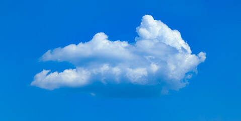 A raster image of a single cloud photographed against a blue sky. Easy relaxed cottony shape. Background quiet sky. Fiber contours after rain. Lonely free substance water. Trivial form of freedom.