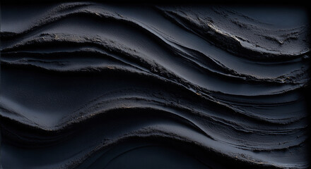 Obraz premium Elegant undulating black sand texture captured in a minimalist style for art or design inspiration