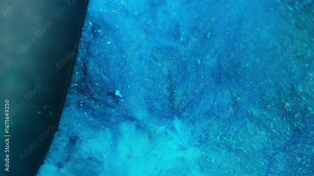 Poster ink in motion creating sea water abstract form. macro