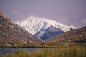 mountain lake with a view of a snow-capped peak - Kyrgyzstan, Tien Shan, Central Asia