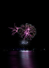 Fototapeta premium Fireworks From Fully Fused Fireworks Over The Water As Part Of The 2025 British Firework Championships Viewed From Queen Anne's Battery, Plymouth