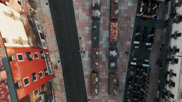 Aerial Drone Top Down Shot Of Piazza Delle Erbe In Verona, Italy Just After Sunrise On A Bright Summer Morning.