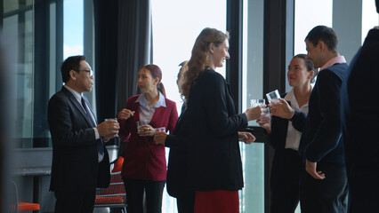 Business professionals networking and enjoying drinks at a corporate event