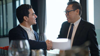 Business professionals networking and enjoying drinks at a corporate event