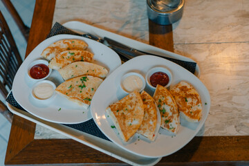 2 servings of Grilled quesadillas on a tray