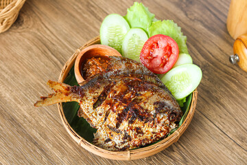Crispy fried ikan bawal (pomfret fish) marinated in sweet soy sauce and butter for a rich, savory...