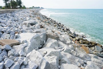 The texture of rocks at the beach estuary to act as a barrier against coastal wave erosion. Serene...
