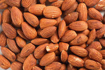 Heap of almonds isolated on white background. Perfect for recipes, articles or any cooking content