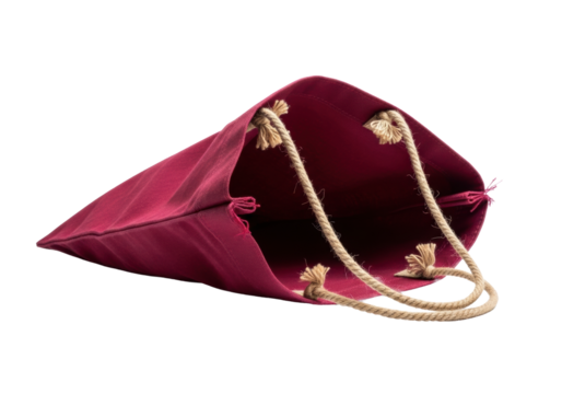 Deep crimson recycled canvas shopping bag, well-used, visible weave, twine handles, partially open, transparent background, copy space, soft studio light. Concept of sustainable shopping